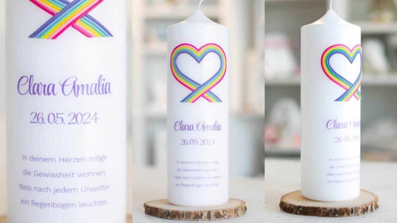 Taufkerze mit Regenbogenherz und Taufspruch in Lila